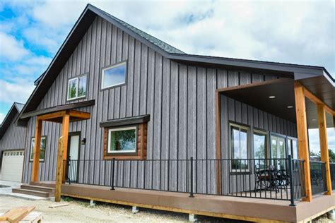 gray house dark gray metal roof|gray siding black windows.